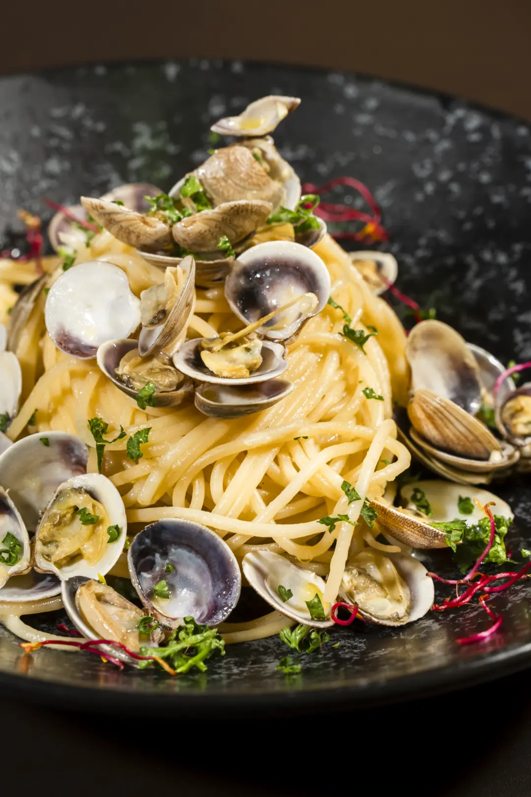Fresh fish: spaghetti with clams at Bouganville restaurant in Trento