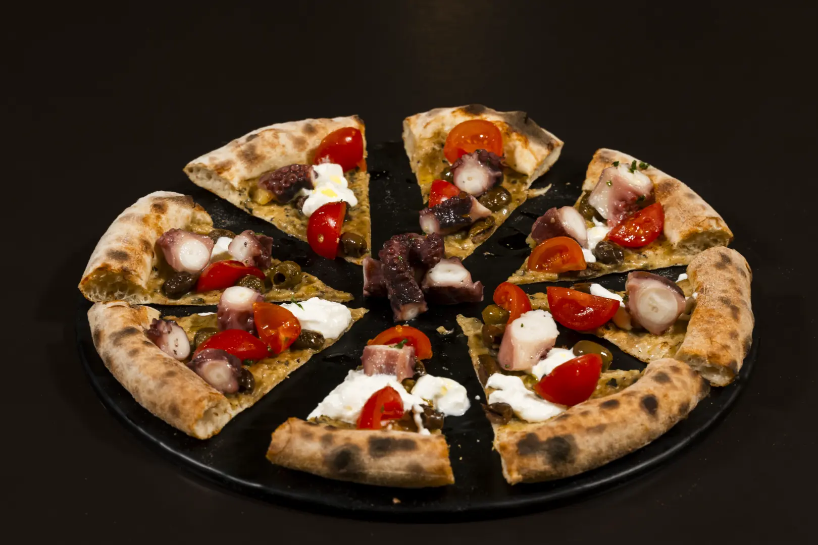 Pizza with cherry tomatoes and mozzarella at Bouganville restaurant
