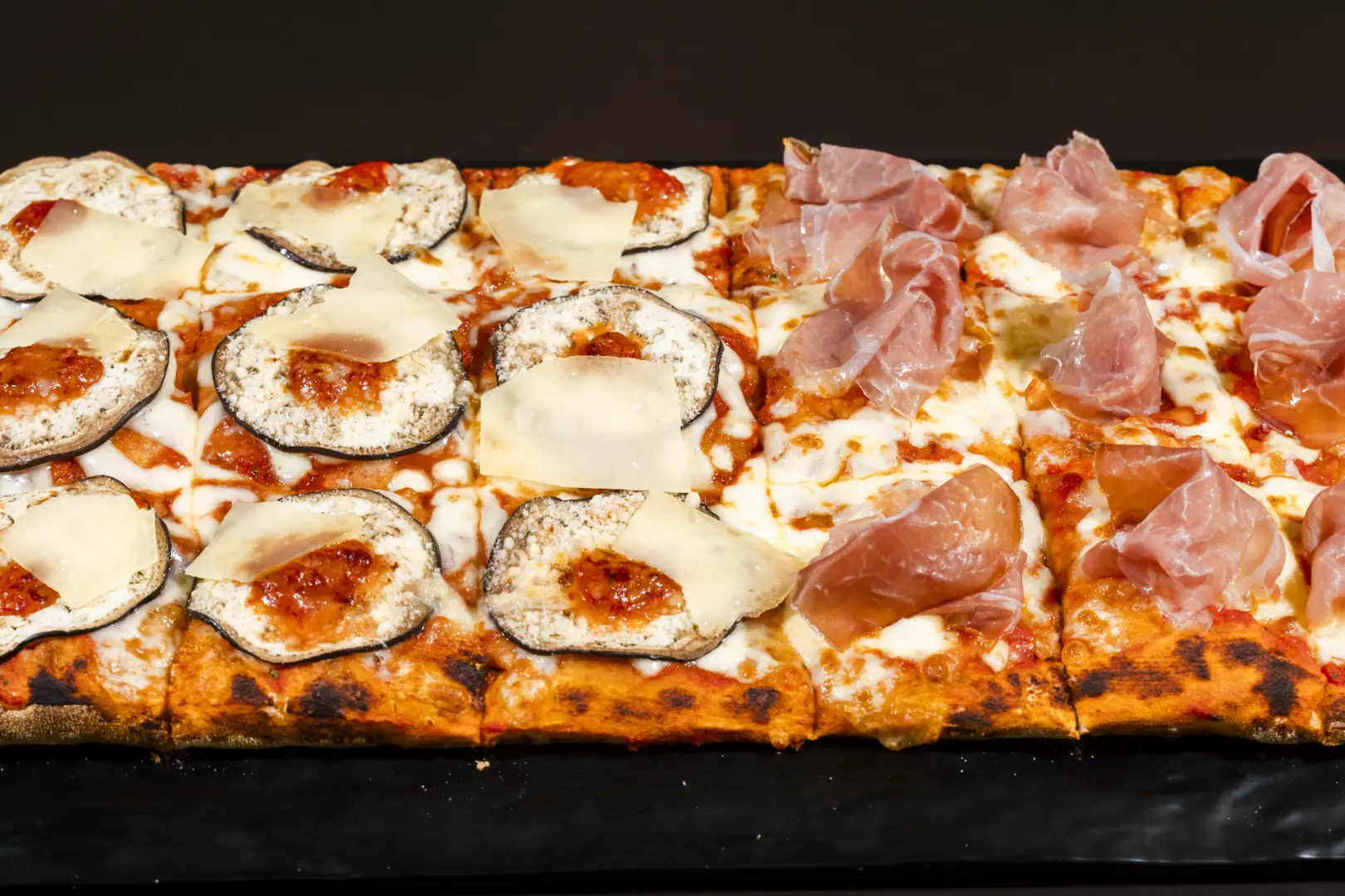 Half-metre pizza alla pala with mozzarella and prosciutto crudo